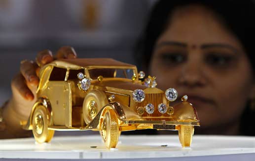 A Miniature Gold Car A Miniature Gold Car