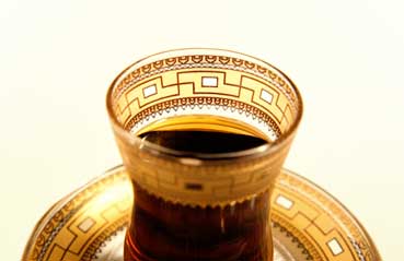 A bowl of sandwich gold glass with a floral design in gold leaf A bowl of sandwich gold glass with a floral design in gold leaf