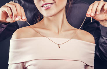 woman wearing gold jewellery woman wearing gold jewellery