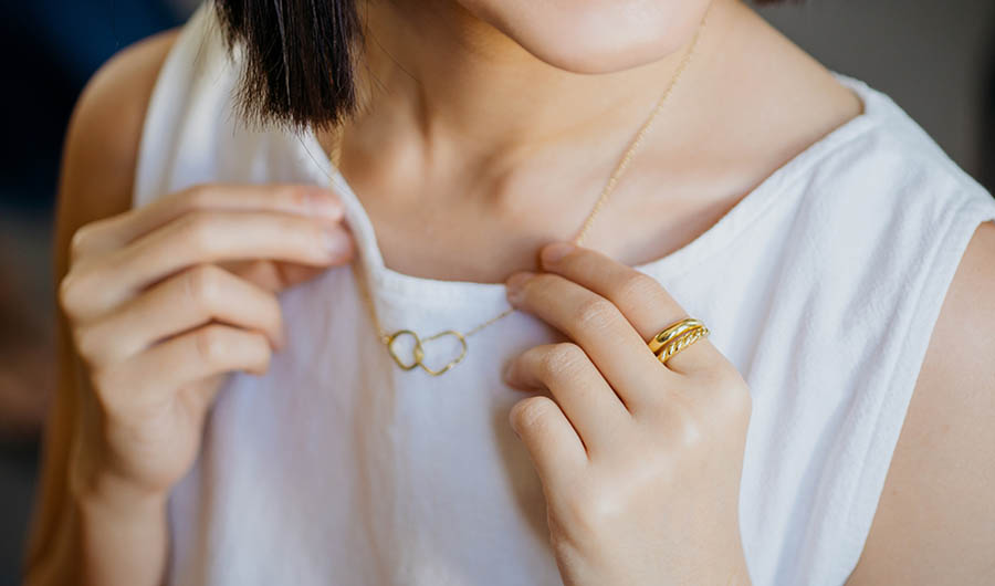 Woman with gold necklace