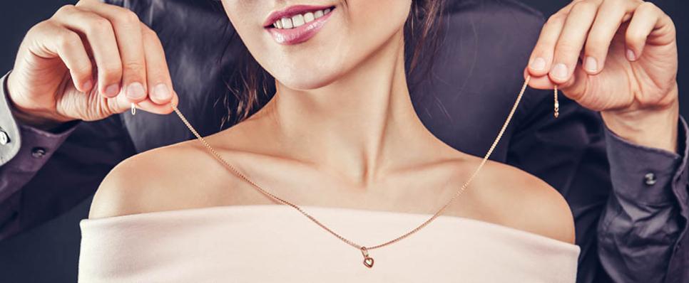 woman wearing gold jewellery woman wearing gold jewellery
